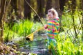 Little girl catching a frog Royalty Free Stock Photo