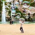 Little girl catching the soap bubbles Royalty Free Stock Photo