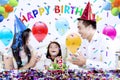 Little girl celebrates birthday party with her parent Royalty Free Stock Photo