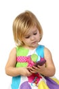 Little girl with cell phone on gray