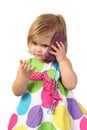 Little girl with cell phone on gray Royalty Free Stock Photo