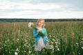 Little girl in a chamomile field Royalty Free Stock Photo