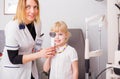 Little girl checking her vision in doctors office