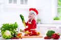 Little girl in chef hat preparing lunch Royalty Free Stock Photo