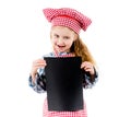 Little girl in chef uniform with blank paper Royalty Free Stock Photo