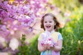 Little girl with cherry blossom Royalty Free Stock Photo