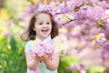 Little girl with cherry blossom Royalty Free Stock Photo