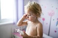 Little girl with chickenpox, antiseptic cream applied to the rash Royalty Free Stock Photo