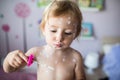 Little girl with chickenpox, antiseptic cream applied to rash. Royalty Free Stock Photo