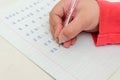 Little girl child doing homework, learning to write letters Royalty Free Stock Photo