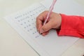 Little girl child doing homework, learning to write letters Royalty Free Stock Photo