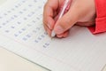 Little girl child doing homework, learning to write letters Royalty Free Stock Photo