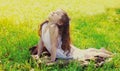 Little girl child doing yoga exercise stretching on grass in sunny summer day Royalty Free Stock Photo