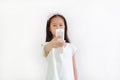 Little girl Child holding remote control over white background. Focus at remote in his hand Royalty Free Stock Photo