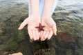 A little girl child holding a starfish in her hands on the seashore. Royalty Free Stock Photo