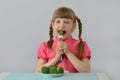 Little girl child, kid loves broccoli Royalty Free Stock Photo