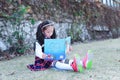 Little girl Child reading a book on the grass Royalty Free Stock Photo