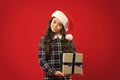 Little girl child in santa red hat. Christmas shopping. Happy winter holidays. Small girl. Present for Xmas. Childhood Royalty Free Stock Photo