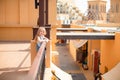 Little girl standing on balcony on sea promenade Royalty Free Stock Photo