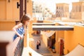 Little girl standing on balcony on sea promenade Royalty Free Stock Photo