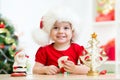 Little girl child wearing a festive red Santa hat Royalty Free Stock Photo