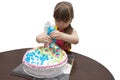 Little girl children decorate cream cake