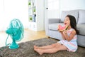 Little girl children sitting on living room floor