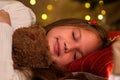 Little girl at Christmas Eve sleeping waiting for gift from Santa Royalty Free Stock Photo