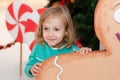 Little girl in Christmas plays in a shopping center