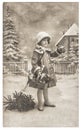Little girl Christmas tree gifts vintage toys Royalty Free Stock Photo