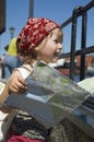 Little girl with a city map. travel