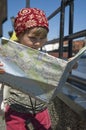 Little girl with a city map. travel