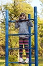 Little girl climb on playground