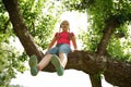 Little girl climbed on tree Royalty Free Stock Photo