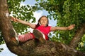 Little girl climbed on tree Royalty Free Stock Photo