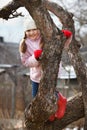 Little girl climbed on tree Royalty Free Stock Photo