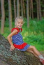 Little girl climbed on tree Royalty Free Stock Photo