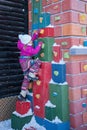 Little girl climbing high in winter.