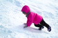 little girl is climbing an ice hill Royalty Free Stock Photo