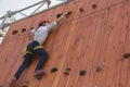 Little girl climbing on an outdoor ropes course. Royalty Free Stock Photo