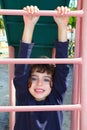 Little girl climbing pink stairs of slide Royalty Free Stock Photo