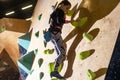 little girl climbing a rock wall indoor Royalty Free Stock Photo