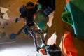 little girl climbing a rock wall indoor Royalty Free Stock Photo