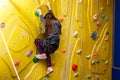 Little Girl Climbing Rock Wall Royalty Free Stock Photo