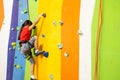 Little Girl Climbing Rock Wall practical wall in gym Royalty Free Stock Photo