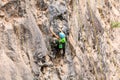 Girl Climbing A Rock Wall