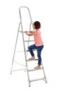 Little girl climbing up  on white background. Danger at home Royalty Free Stock Photo