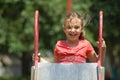 Little Girl Climbing Up Slide Royalty Free Stock Photo