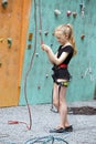 Little girl climbing up the wall