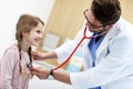 Little girl in clinic having a checkup with pediatrician Royalty Free Stock Photo